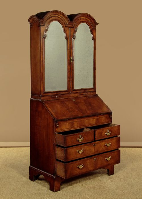 A Queen Anne style burr walnut bureau cabinet featuring a double-domed top with twin mirrored doors above a slant-front writing slope and lower drawers. View III