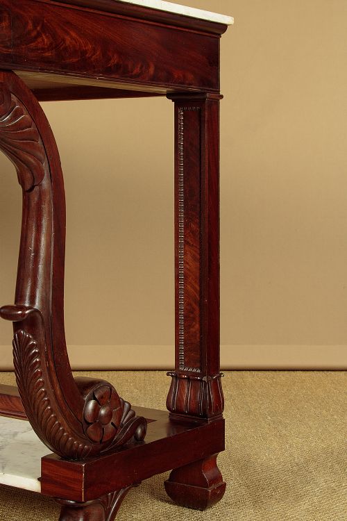 A 19th-century mahogany console table with a white marble top, lower marble tier, carved scroll legs, and paw feet. View IX