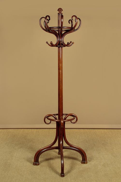 A pair of tall dark brown bentwood hallstands featuring curved coat hooks at the top and circular loops at the base for umbrellas. View III