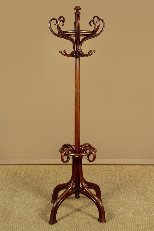 A pair of tall dark brown bentwood hallstands featuring curved coat hooks at the top and circular loops at the base for umbrellas. View IV