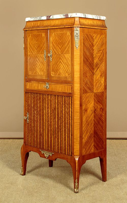 A tall Louis XVI style wooden side cabinet featuring geometric herringbone parquetry veneers, brass mounts, and a polished marble top. View IV