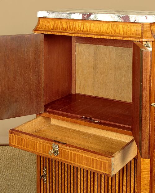 A tall Louis XVI style wooden side cabinet featuring geometric herringbone parquetry veneers, brass mounts, and a polished marble top. View VIII