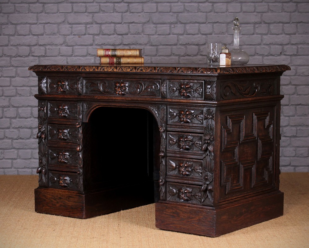 Carved Oak Kneehole Desk with Lion’s Mask Handles c.1890.