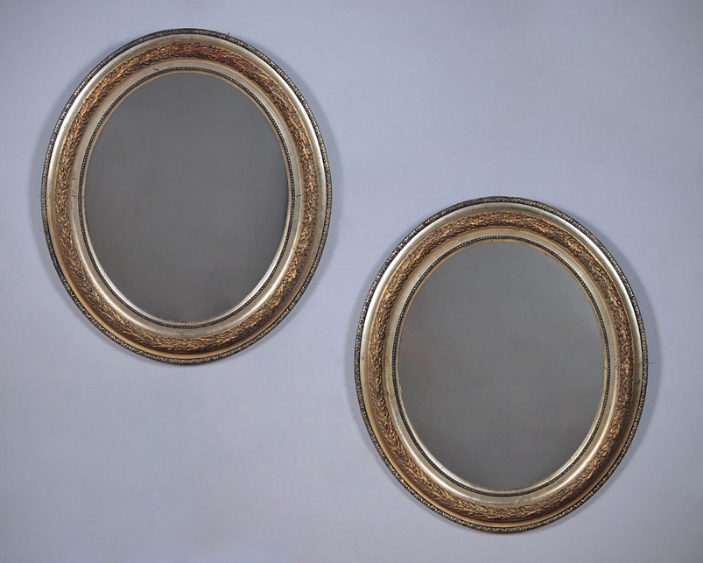 Pair of Oval Gilt Mirrors c.1890.