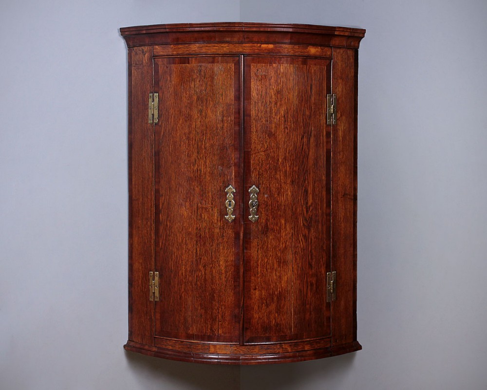 George III Oak Bow Front Corner Cupboard c.1810.