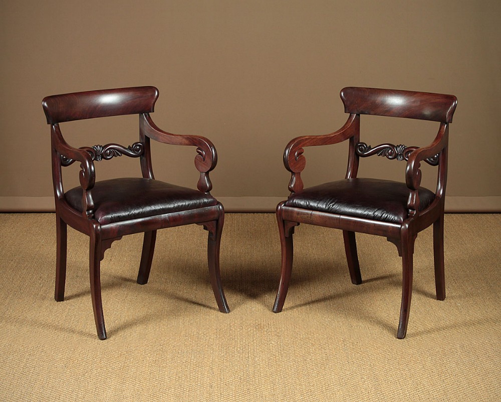Pair of Regency Sabre Leg Armchairs c.1830.