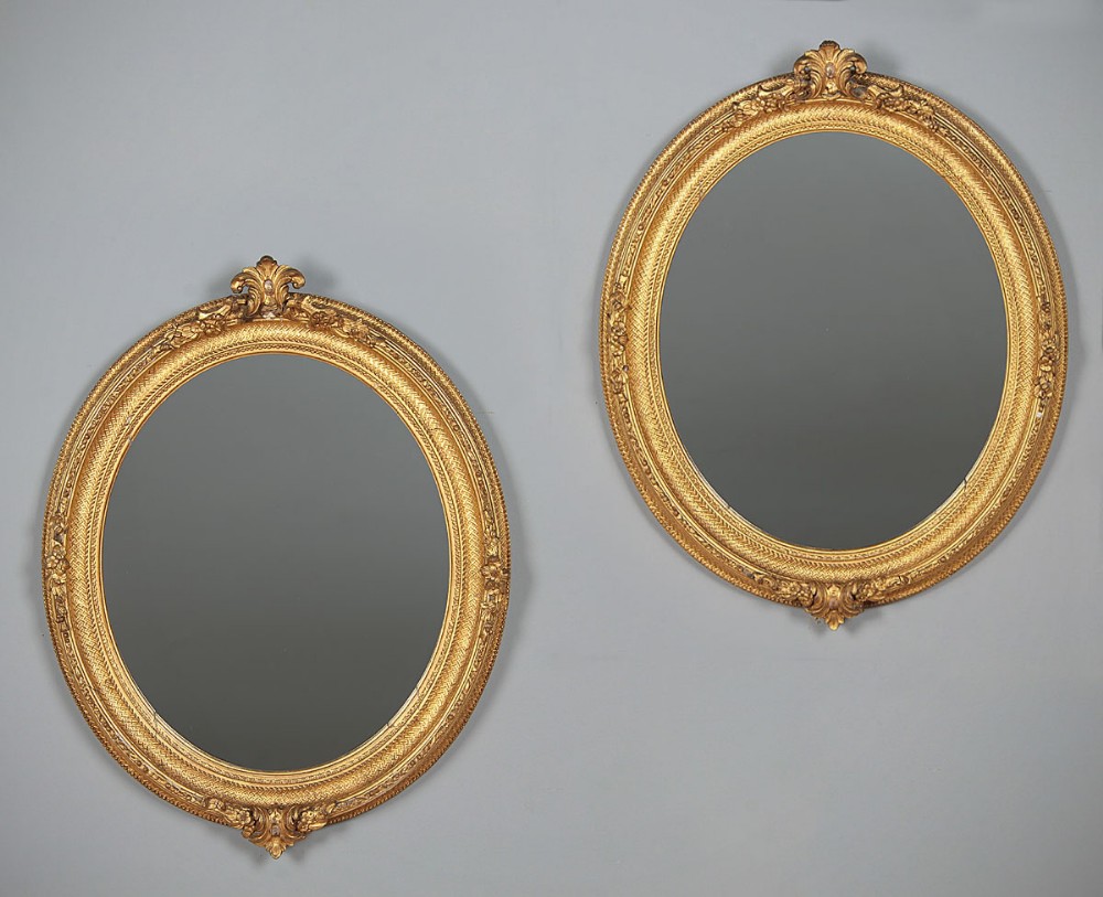 Pair of Oval Gilt Frame Mirrors c.1880.