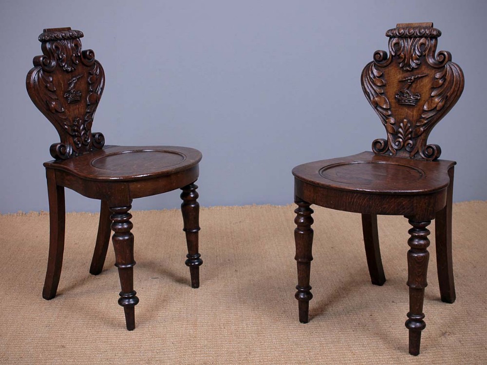Pair of Oak Hall Chairs with Heraldic Carving c.1830.