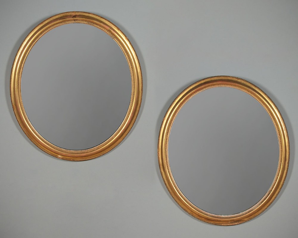 Pair of Large Gilded Oval Wall Mirrors c.1890.