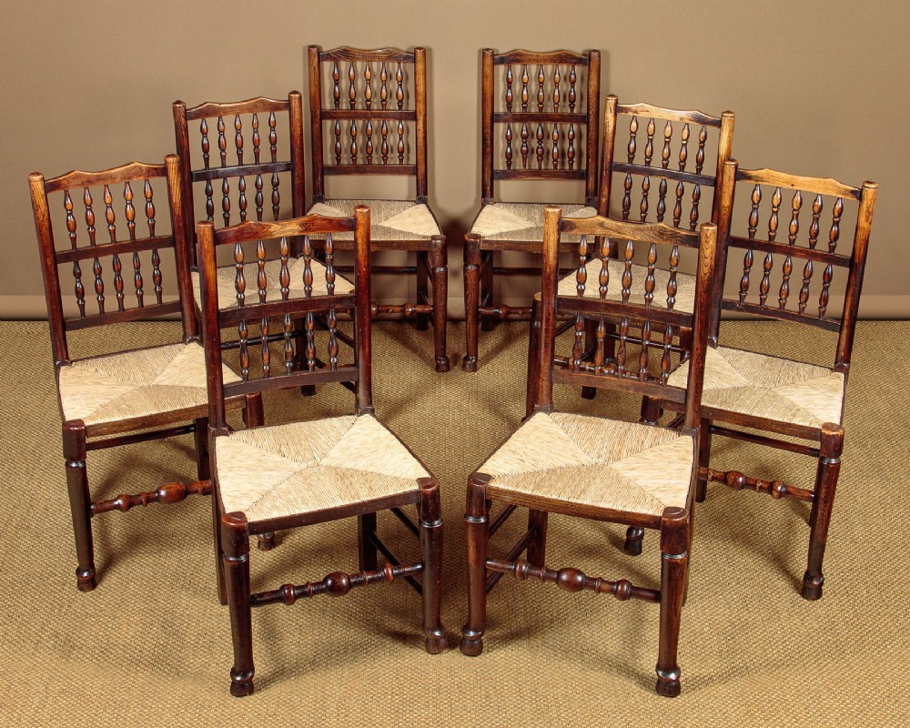 Eight Spindle Back Rush Seat Dining Chairs c.1810