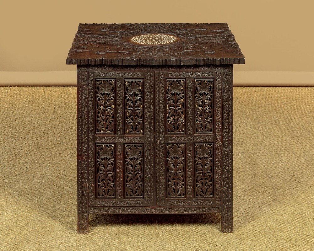 A dark wood square Anglo-Indian side table decorated with reticulated foliate carving on all panels and a circular bone inlay detail in the centre top. View III