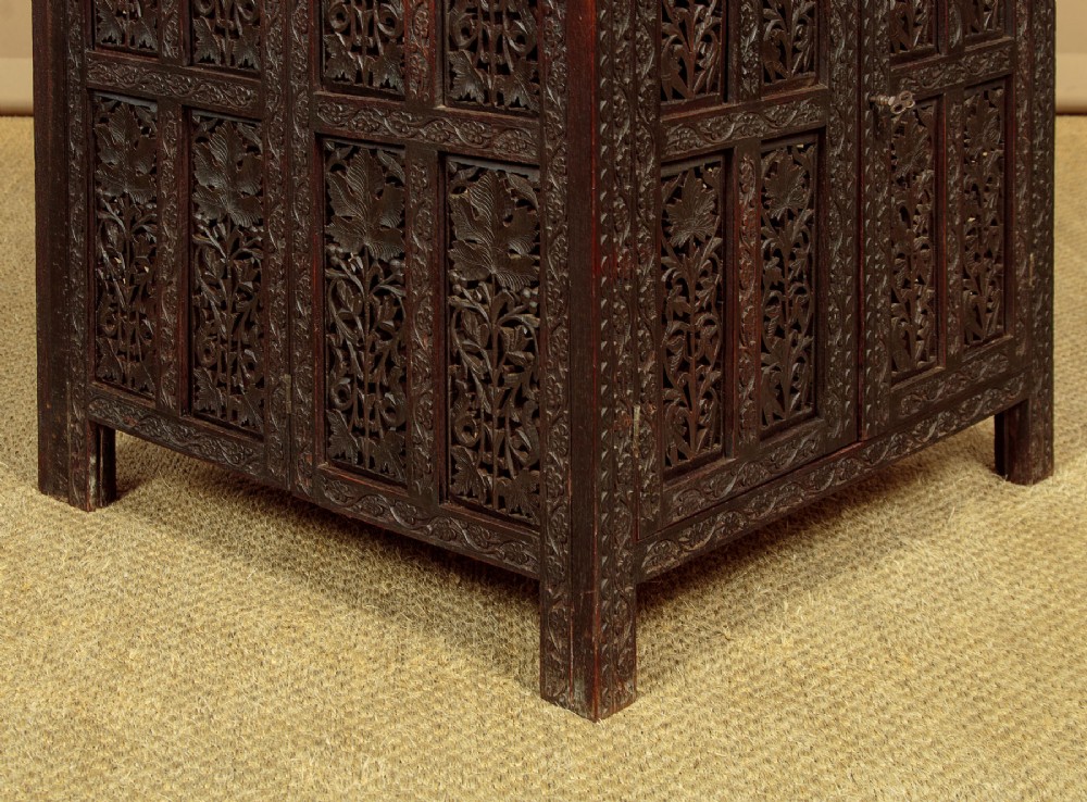 A dark wood square Anglo-Indian side table decorated with reticulated foliate carving on all panels and a circular bone inlay detail in the centre top. View V