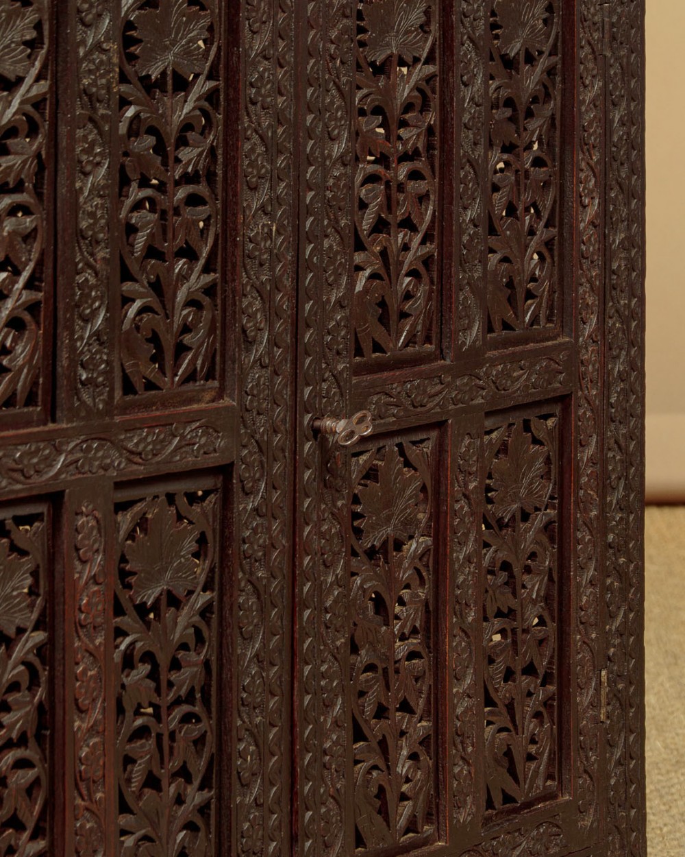 A dark wood square Anglo-Indian side table decorated with reticulated foliate carving on all panels and a circular bone inlay detail in the centre top. View VI