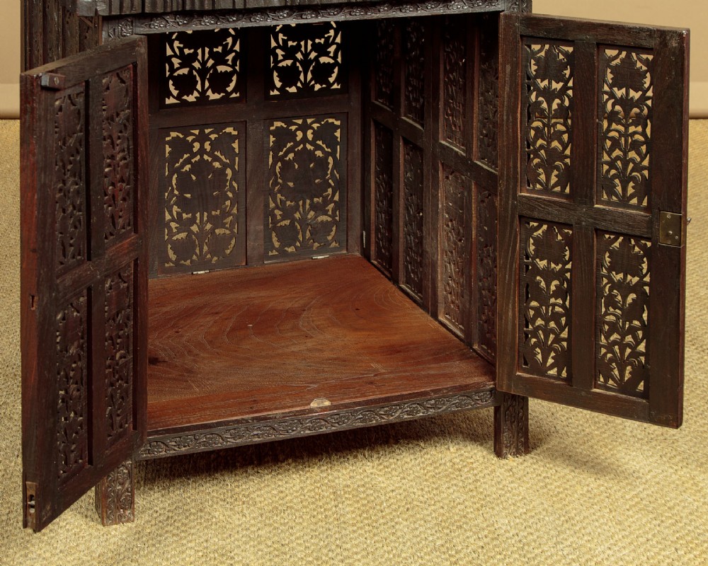 A dark wood square Anglo-Indian side table decorated with reticulated foliate carving on all panels and a circular bone inlay detail in the centre top. View VII