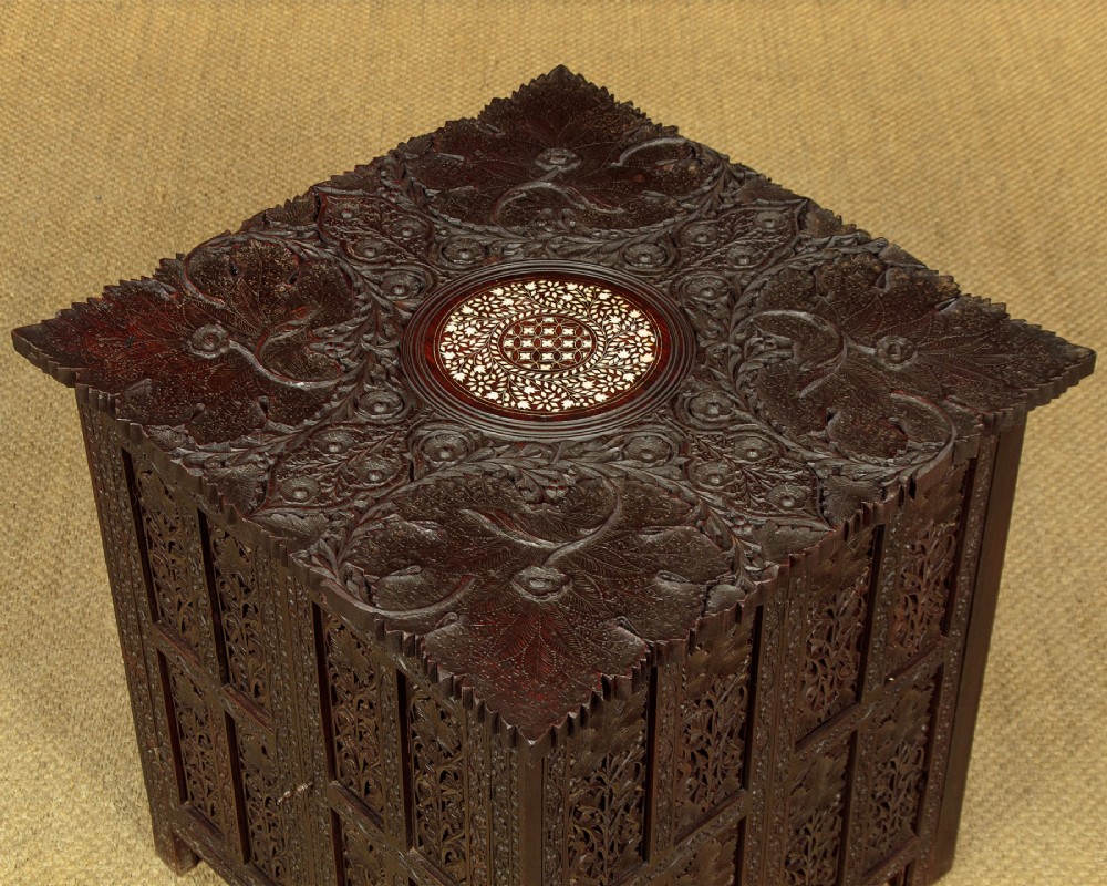 A dark wood square Anglo-Indian side table decorated with reticulated foliate carving on all panels and a circular bone inlay detail in the centre top. View VIII