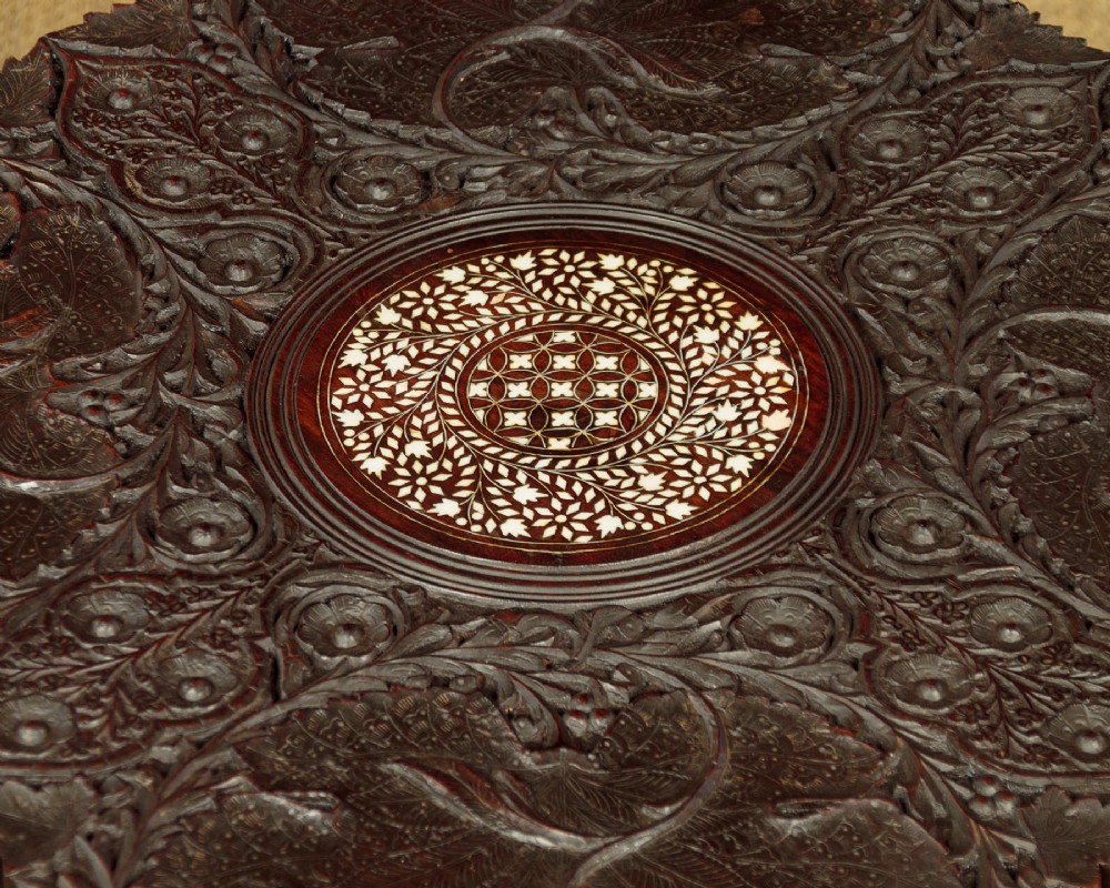 A dark wood square Anglo-Indian side table decorated with reticulated foliate carving on all panels and a circular bone inlay detail in the centre top. View IX