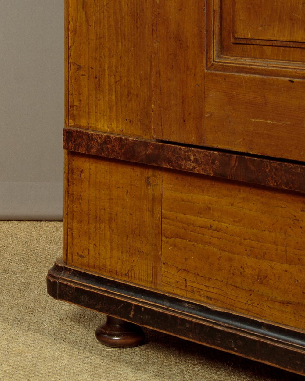 A single-door pine wardrobe featuring hand-painted urn motifs on two panelled sections and a dated inscription near the moulded cornice. View XIII