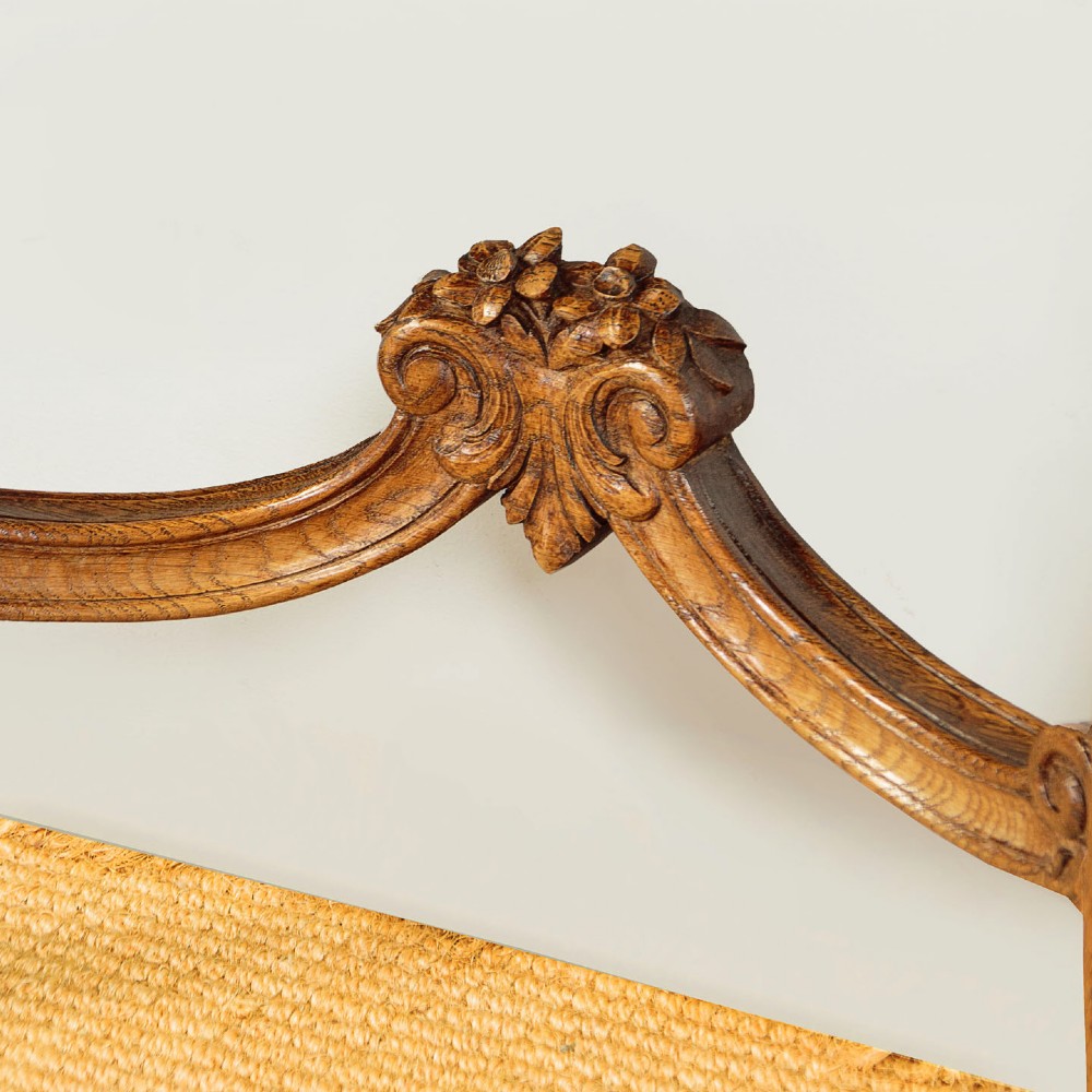 An oak console table featuring a shaped grey marble top, floral relief carvings along the apron, exaggerated cabriole legs, and a scrolled stretcher. View VIII