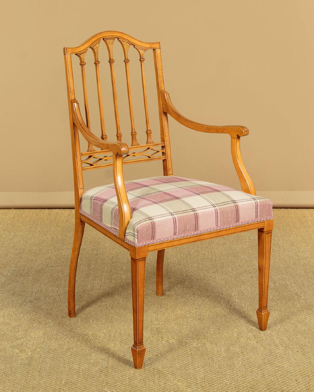 A pair of inlaid satinwood armchairs featuring arched spindle backrests and pink plaid upholstered seats. View II