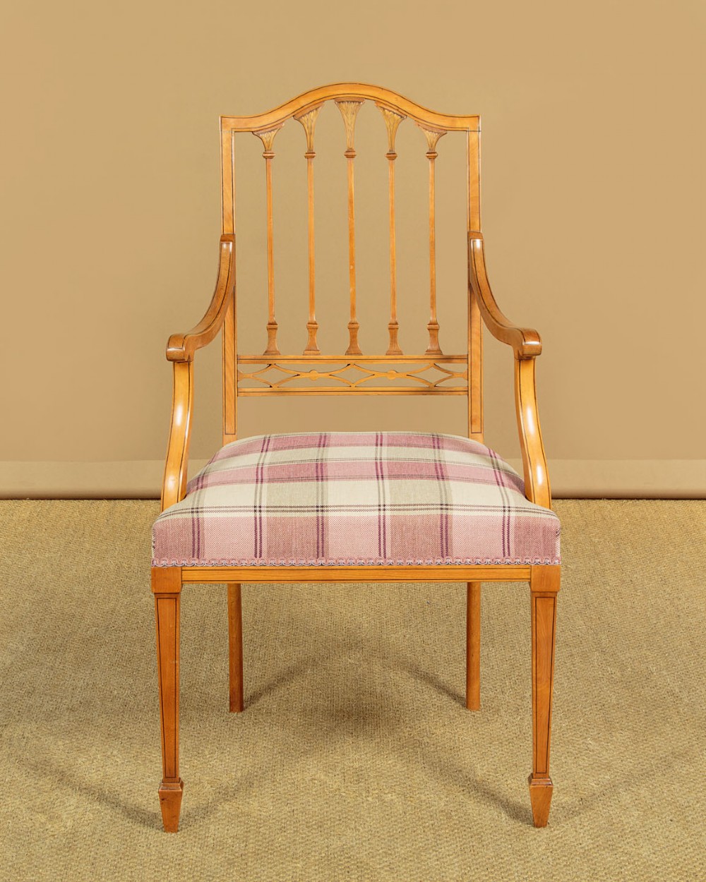 A pair of inlaid satinwood armchairs featuring arched spindle backrests and pink plaid upholstered seats. View III