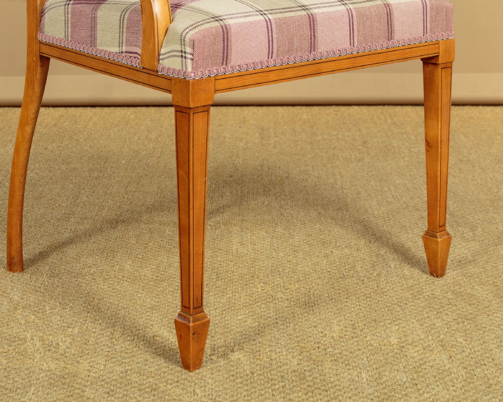 A pair of inlaid satinwood armchairs featuring arched spindle backrests and pink plaid upholstered seats. View XI