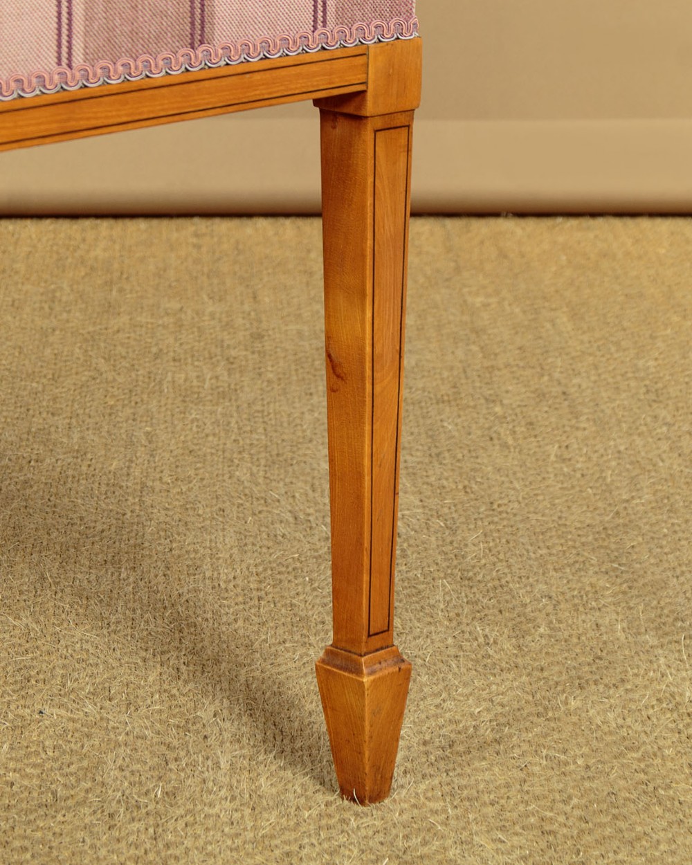 A pair of inlaid satinwood armchairs featuring arched spindle backrests and pink plaid upholstered seats. View XII