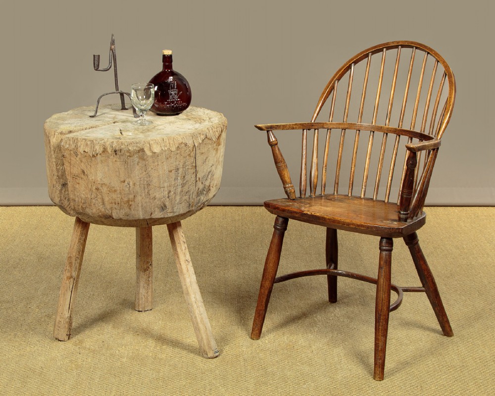 A rustic French provincial elm chopping block featuring a thick cylindrical wood top with three splayed timber legs. View II