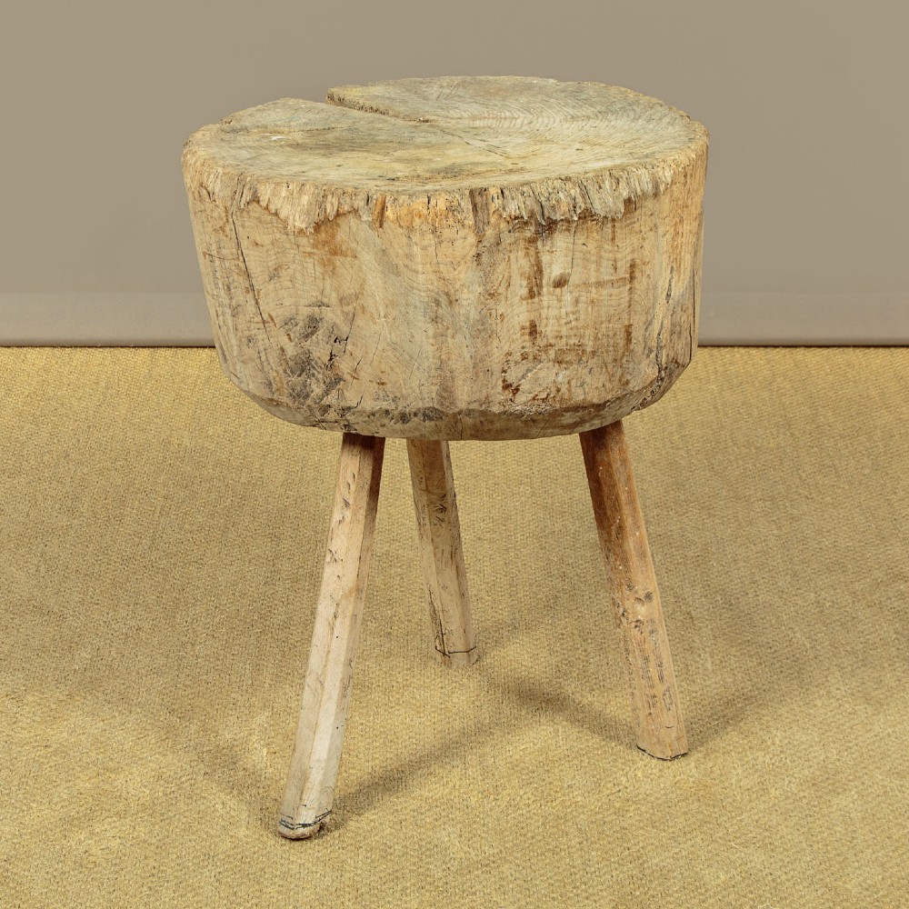 A rustic French provincial elm chopping block featuring a thick cylindrical wood top with three splayed timber legs. View IV