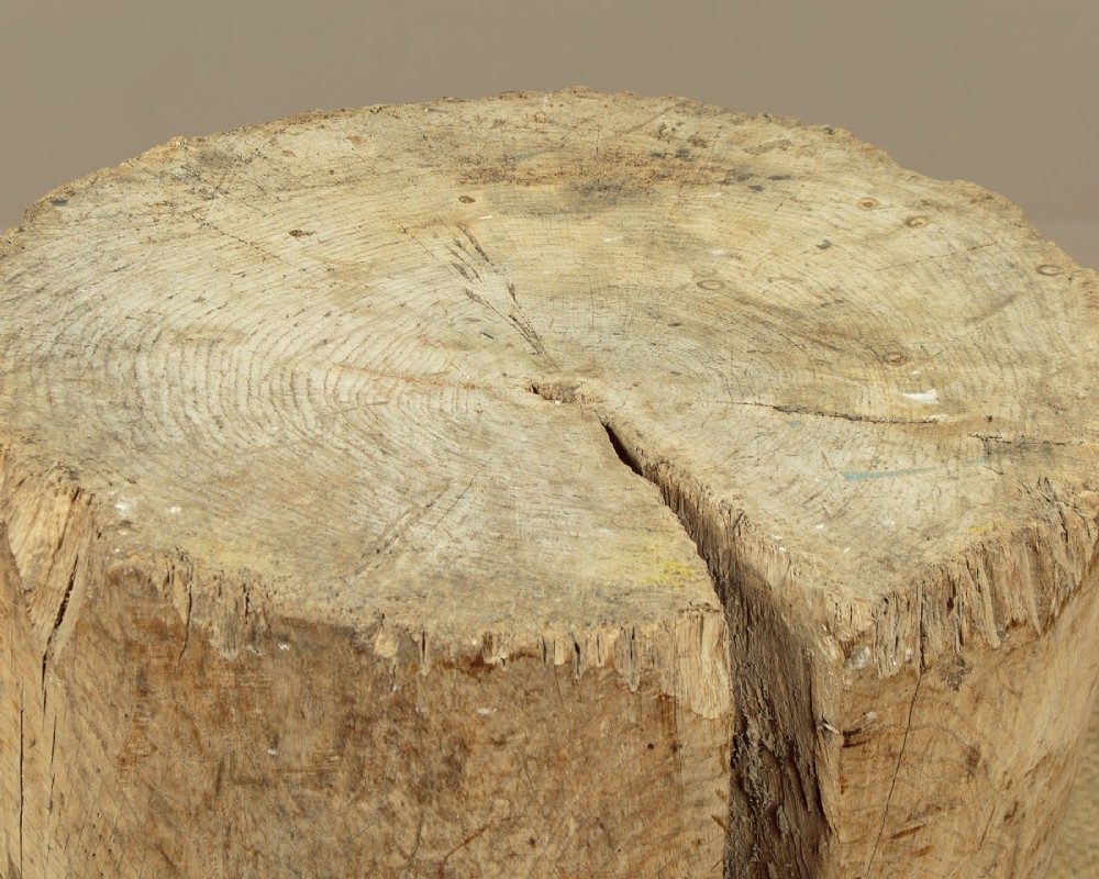 A rustic French provincial elm chopping block featuring a thick cylindrical wood top with three splayed timber legs. View VII
