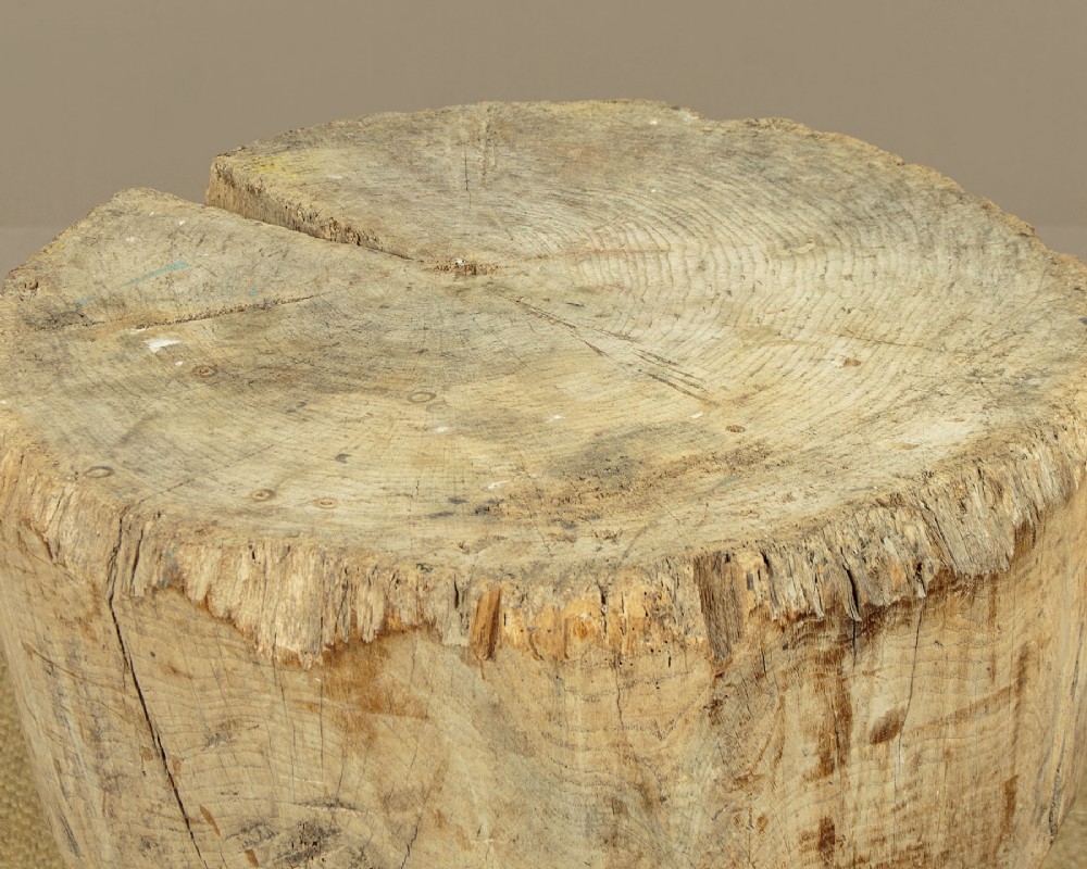 A rustic French provincial elm chopping block featuring a thick cylindrical wood top with three splayed timber legs. View VIII