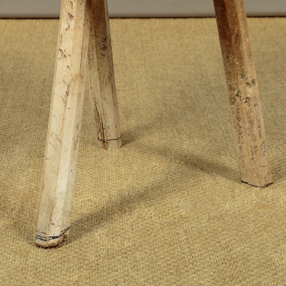 A rustic French provincial elm chopping block featuring a thick cylindrical wood top with three splayed timber legs. View XI
