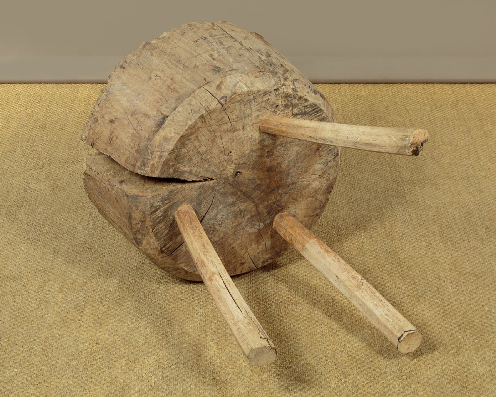 A rustic French provincial elm chopping block featuring a thick cylindrical wood top with three splayed timber legs. View XII