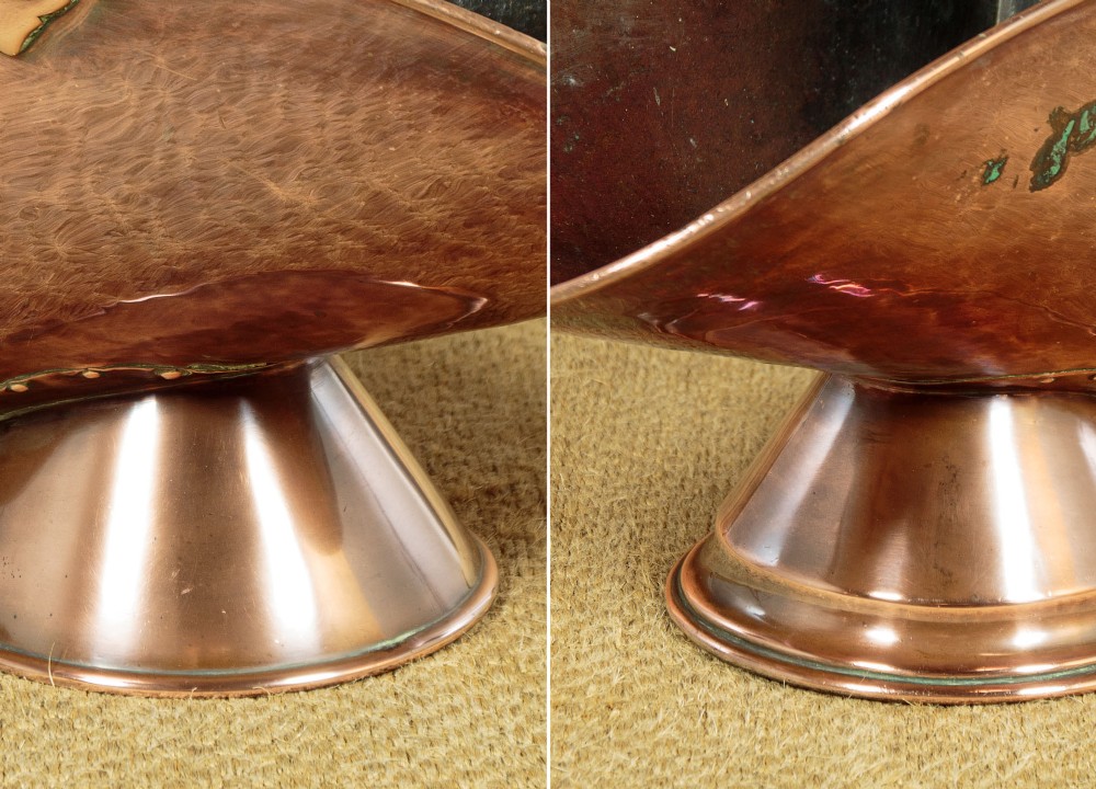 A pair of Victorian copper helmet-style coal scuttles featuring flared circular pedestals and curved swing handles. View XIV