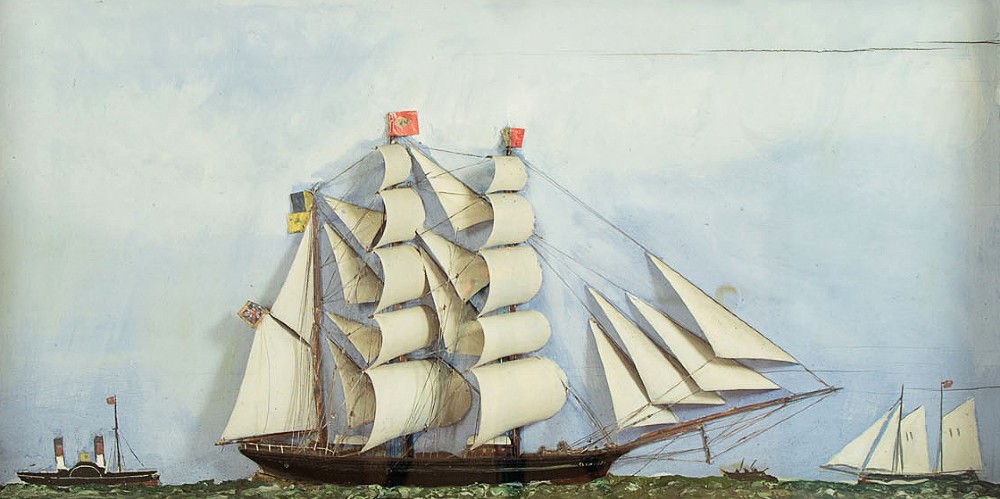 A three-dimensional antique maritime diorama featuring a three-masted sailing ship framed in a deep glazed wooden box with a painted sky and sea background. View III