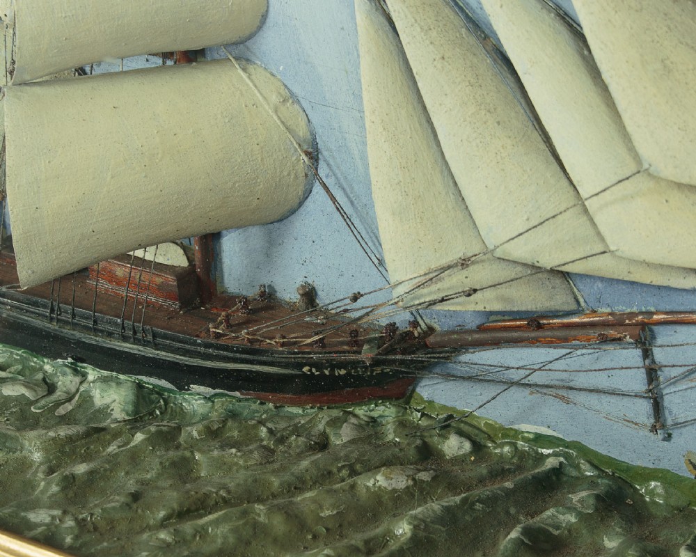 A three-dimensional antique maritime diorama featuring a three-masted sailing ship framed in a deep glazed wooden box with a painted sky and sea background. View VII