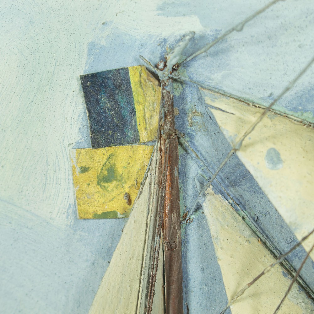 A three-dimensional antique maritime diorama featuring a three-masted sailing ship framed in a deep glazed wooden box with a painted sky and sea background. View IX
