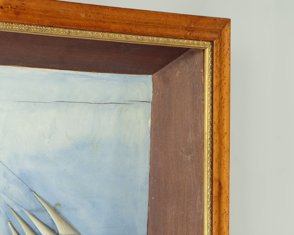 A three-dimensional antique maritime diorama featuring a three-masted sailing ship framed in a deep glazed wooden box with a painted sky and sea background. View XII