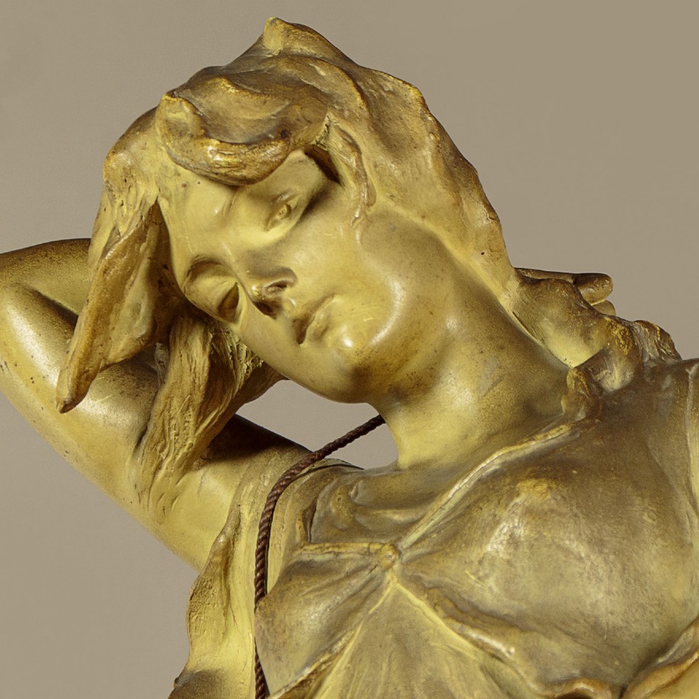An Art Nouveau terracotta sculpture depicting a draped female water carrier holding two vessels. View VII