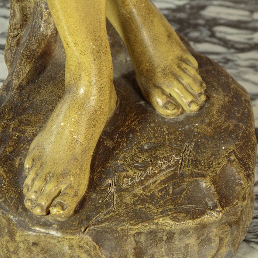 An Art Nouveau terracotta sculpture depicting a draped female water carrier holding two vessels. View XIII