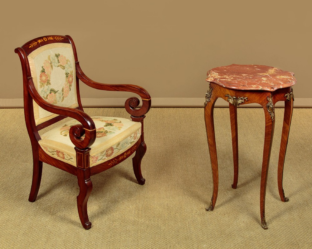 A French Louis XV style wine table with a contoured red marble top, parquetry veneer, metal mounts, and cabriole legs. View III