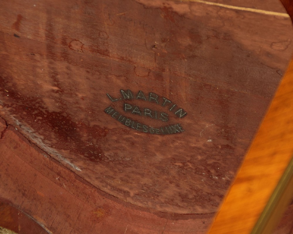 A French Louis XV style wine table with a contoured red marble top, parquetry veneer, metal mounts, and cabriole legs. View XIV