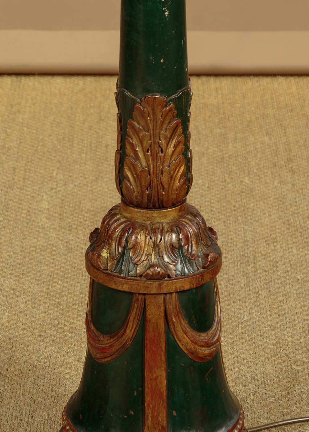 A tall Neoclassical style painted dark green and gilt wooden standard lamp featuring carved acanthus leaf details and a bell-shaped base. View VII