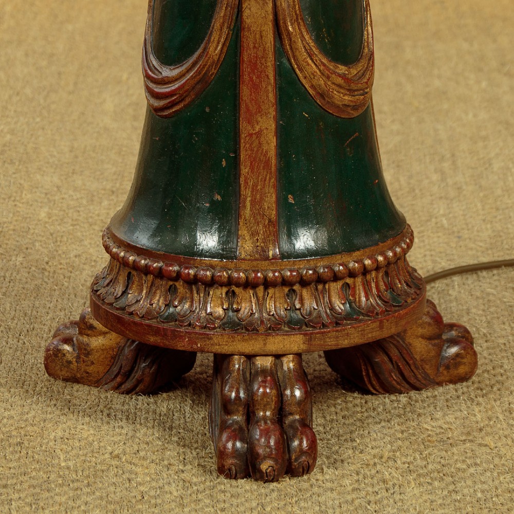 A tall Neoclassical style painted dark green and gilt wooden standard lamp featuring carved acanthus leaf details and a bell-shaped base. View IX