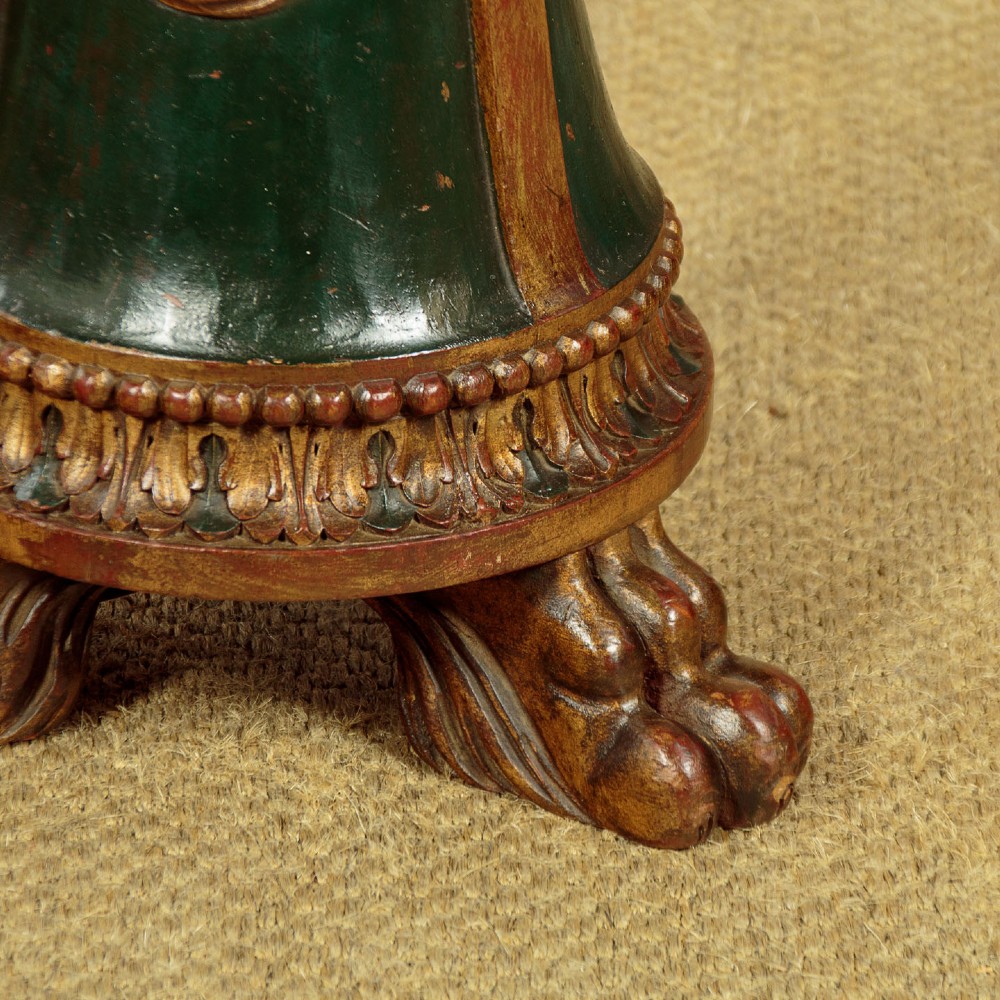 A tall Neoclassical style painted dark green and gilt wooden standard lamp featuring carved acanthus leaf details and a bell-shaped base. View X