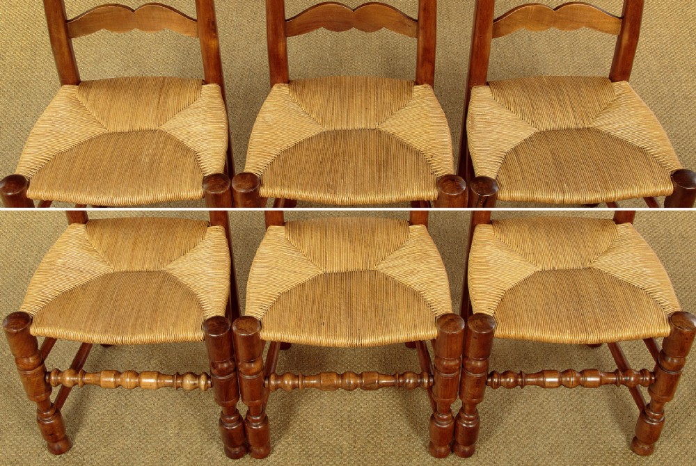 A set of six wooden ladderback dining chairs featuring wavy back slats, turned front legs, and woven rush seats. View VII