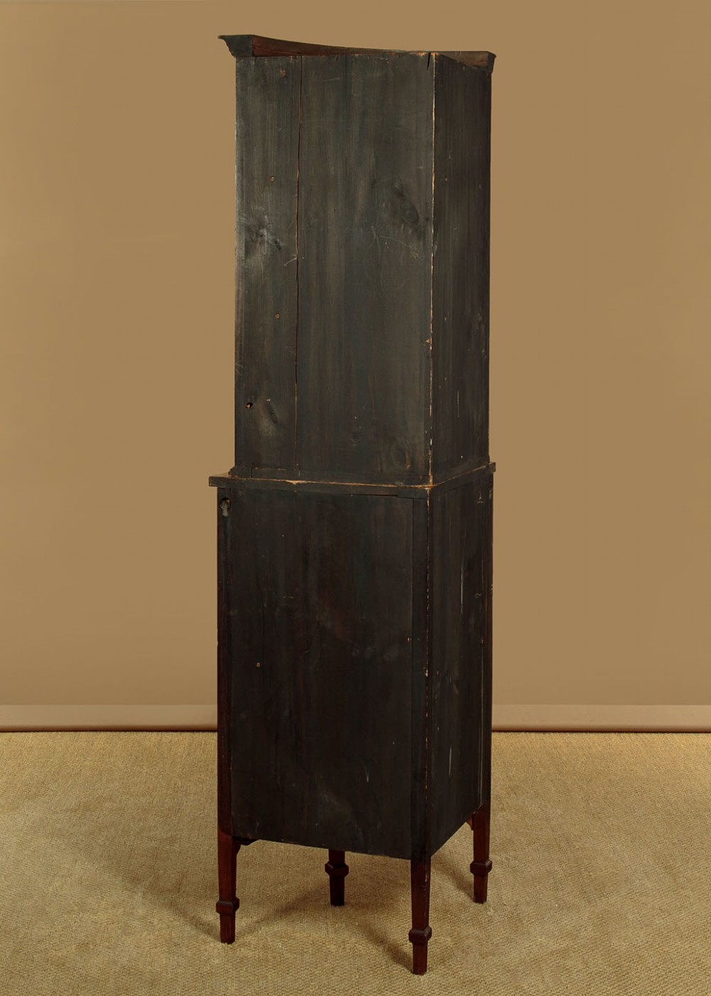 A two-tiered mahogany bow front corner display cabinet featuring upper gothic arch astragal glazing and lower glass panels. View XIII