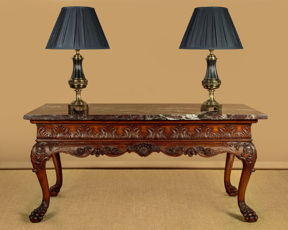 A George II style side table featuring a carved wooden frame with cabriole legs, ball and claw feet, and a polished dark marble top. View II