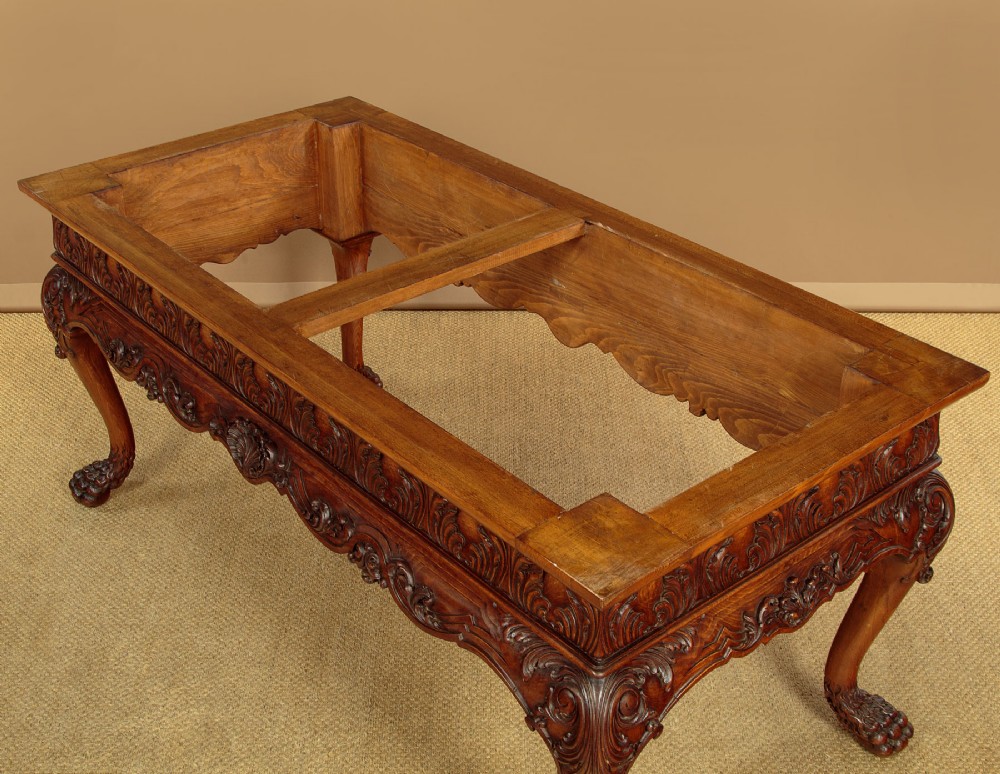 A George II style side table featuring a carved wooden frame with cabriole legs, ball and claw feet, and a polished dark marble top. View XII