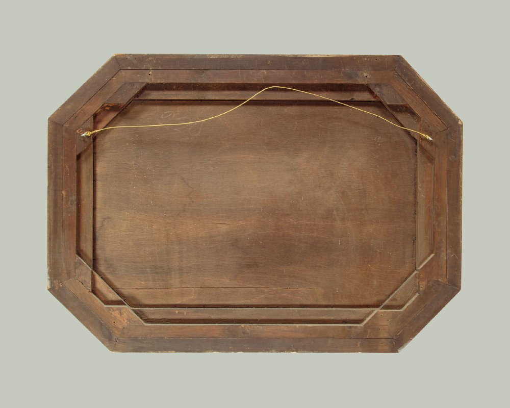 An octagonal gilded cushion frame mirror featuring floral embossed moulding and bevelled mirror inserts around a central glass plate. View VIII