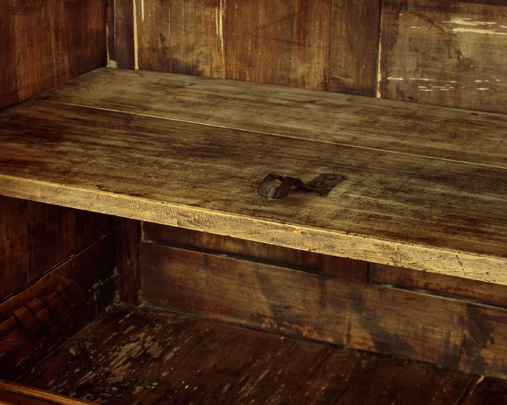 A 19th-century French cherrywood enfilade featuring three drawers over three panelled doors with geometric wood grain and brass escutcheons. View IX